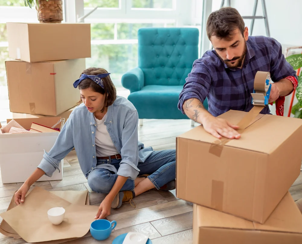 Image of a couple packing boxes
